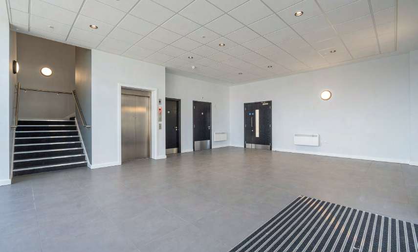 Office entrance lobby with stairs and lift