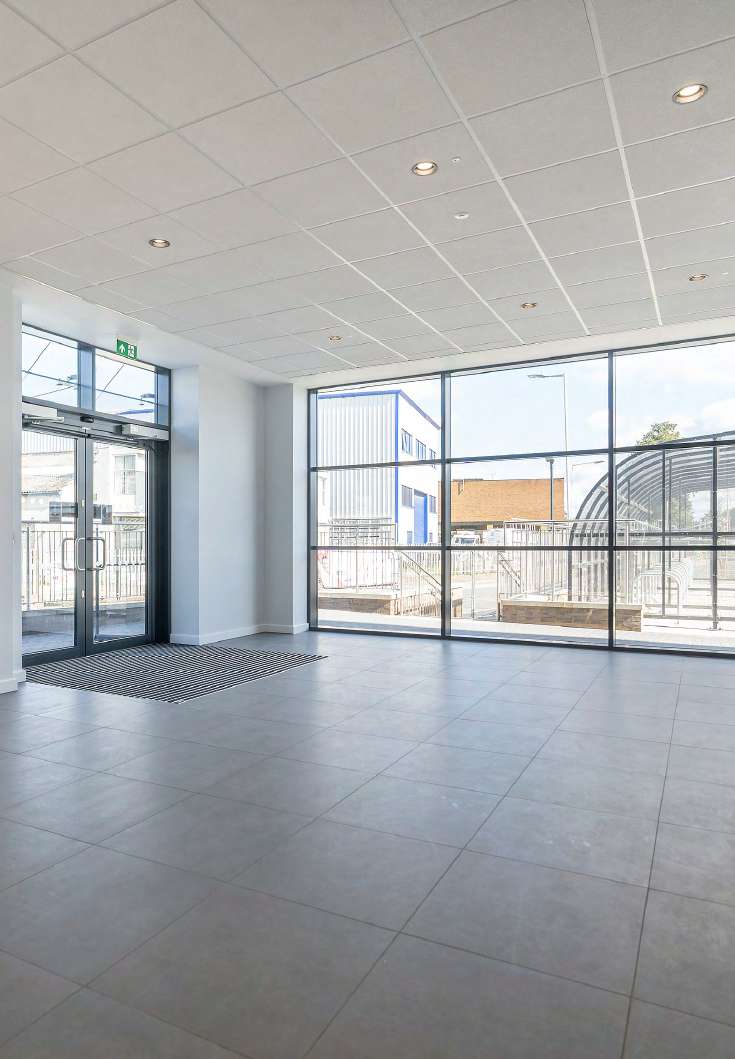 Fully glazed reception looking out to the yard and cycle store